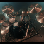 Yanic Bercier behind his Yamaha drum kit in music video As Hope Welcomes Death by Gone in April