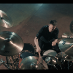 Yanic Bercier behind his Yamaha drum kit in music video As Hope Welcomes Death by Gone in April