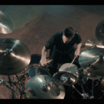 Yanic Bercier behind his Yamaha drum kit in music video As Hope Welcomes Death by Gone in April