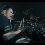 Yanic Bercier behind his Yamaha drum kit in music video As Hope Welcomes Death by Gone in April