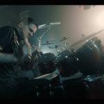 Yanic Bercier behind his Yamaha drum kit in music video As Hope Welcomes Death by Gone in April