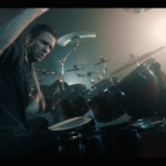 Yanic Bercier behind his Yamaha drum kit in music video As Hope Welcomes Death by Gone in April