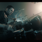 Yanic Bercier behind his Yamaha drum kit in music video As Hope Welcomes Death by Gone in April